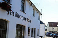 The Thatched House Pub And outside