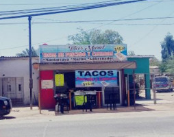 Tacos De Pescado Y Camaron Mariel outside