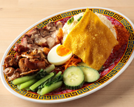 Hainanese Chicken Rice Served With Soy Chicken And Bbq Pork