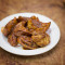 Pan Fried Chicken Momo In Hot Garlic Sauce (8 Pcs)
