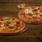Pizza Paradise No Vegetariana Mediana Pizza Kheema Y Salchicha Mediana (Gratis)