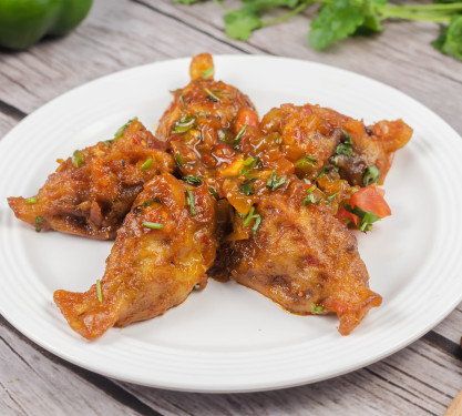 Pan Fried Chicken Momos (Tossed With Sauce)