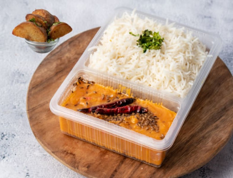 Plain Rice With Dal Fry And Potato Wedges.