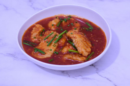 Sizzling Fish With Green Onion In A Spicy Tomato Sauce