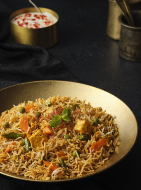 Tarkari Kesari Biryani Served With Raita Salad