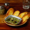 Pesto Hummus With Roasted Garlic Bread