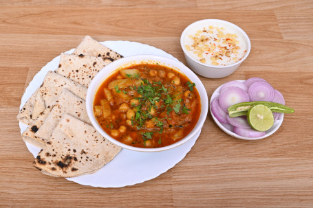 Aloo Chola With Raita Or 5 Twa Butter Roti Combo