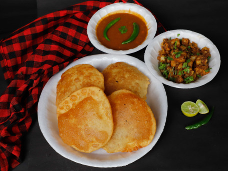 Poori Per Plate (3 Pcs) (Served With Aloo Sabzi, Matar Sabzi, Pickle And Salad)