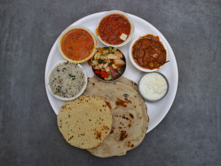 Fixed Punjabi Thali (Paneer Sabji 1 Veg Sabji 1 Dal 1 Rice 1 Tandoori Roti 3 Papad Curd Kachumber)