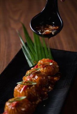 Chicken Steamed Dimsum With Manchurian Sauce