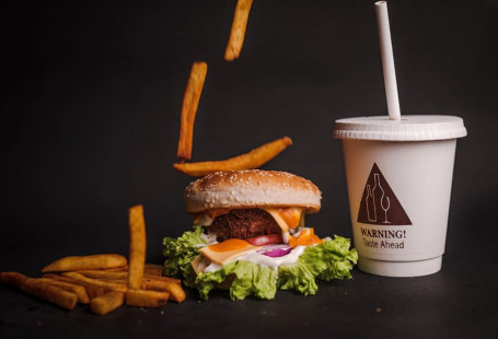 1 Veg Cheesy Item Bomb Burger With Midsize Fries Cold Brew Coffee