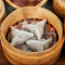 hēi sōng lù xiān jiǎo Steamed Shrimp Dumplings with Black Truffle Sauce