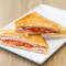 Ham, Cheese, And Tomato Toasted Sandwich