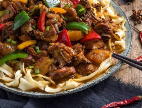 Stewed Chicken With Potato, Handmade Noodle In Spicy Sauce Xīn Jiāng Dà Pán Jī