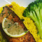 Salmon Over Yellow Rice Side Broccoli