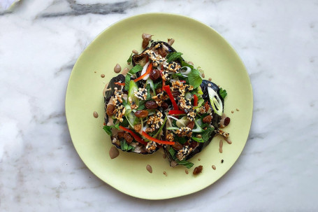 Roasted Aubergine With Chinkiang Tahini, Yuzu Sultanas And Sesame Brittle