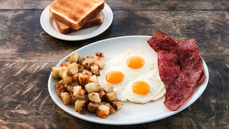 3 Huevos, Papas Fritas Caseras, Tostadas De Pavo Bacon (4 Piezas)