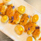 Grilled wings, roasted mango mojo, sweet potato and egg yolk cream.