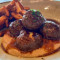 Meatballs stuffed with cheese and accompanied by its demi-glace, aniseed-infused purée and rustic potatoes.
