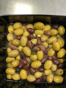 Pitted And Marinated Olives With Garlic Cloves And Sweet Peppers